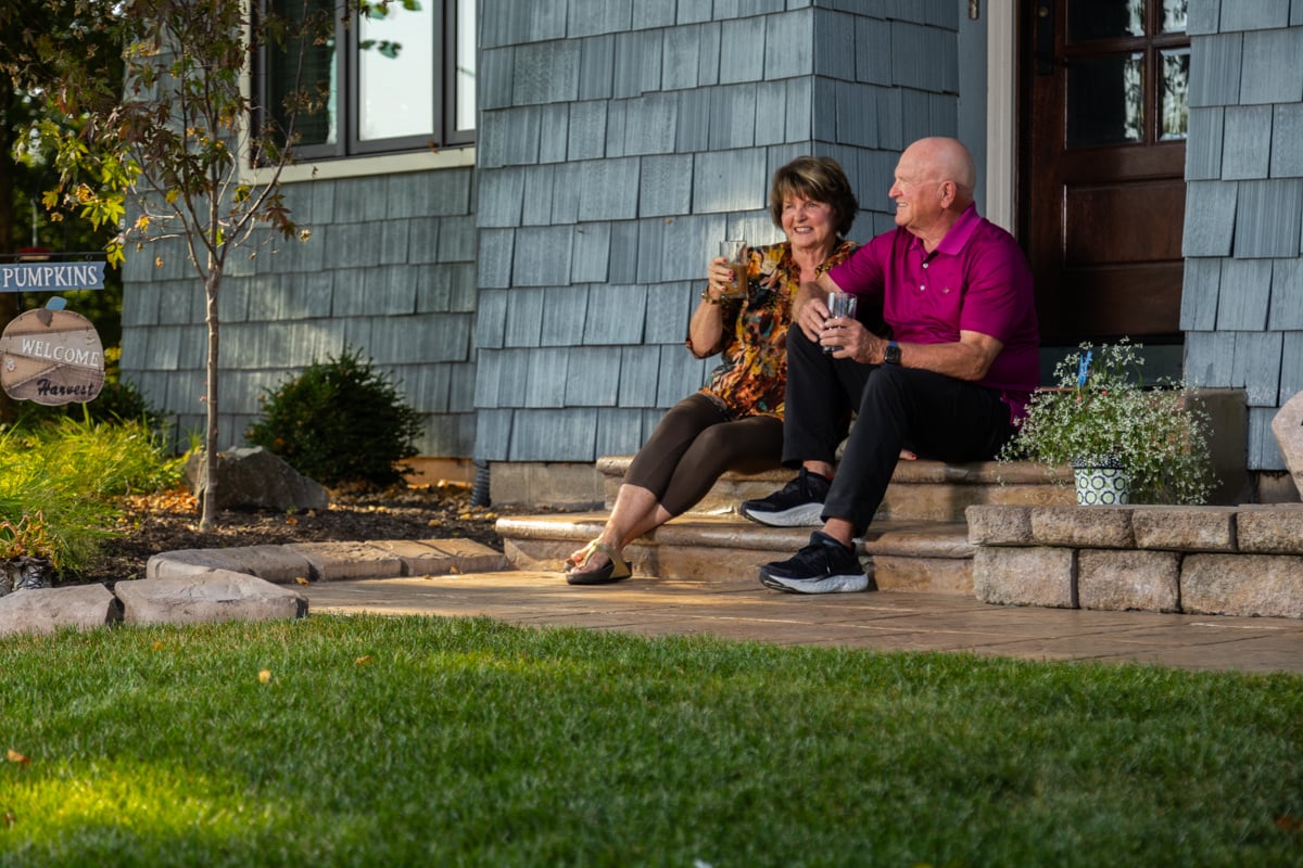homeowners enjoying their tick-free yard