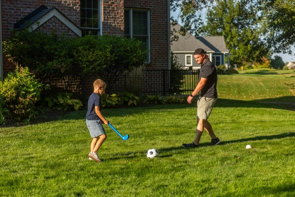 family enjoying playing in a safe, mosquito-free yard