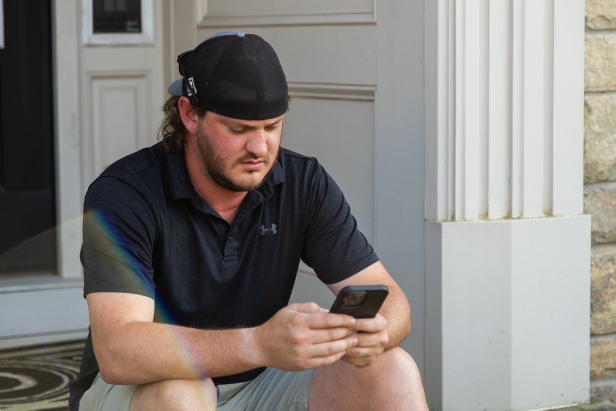 indiana homeowner researching yard ticks and flea solutions