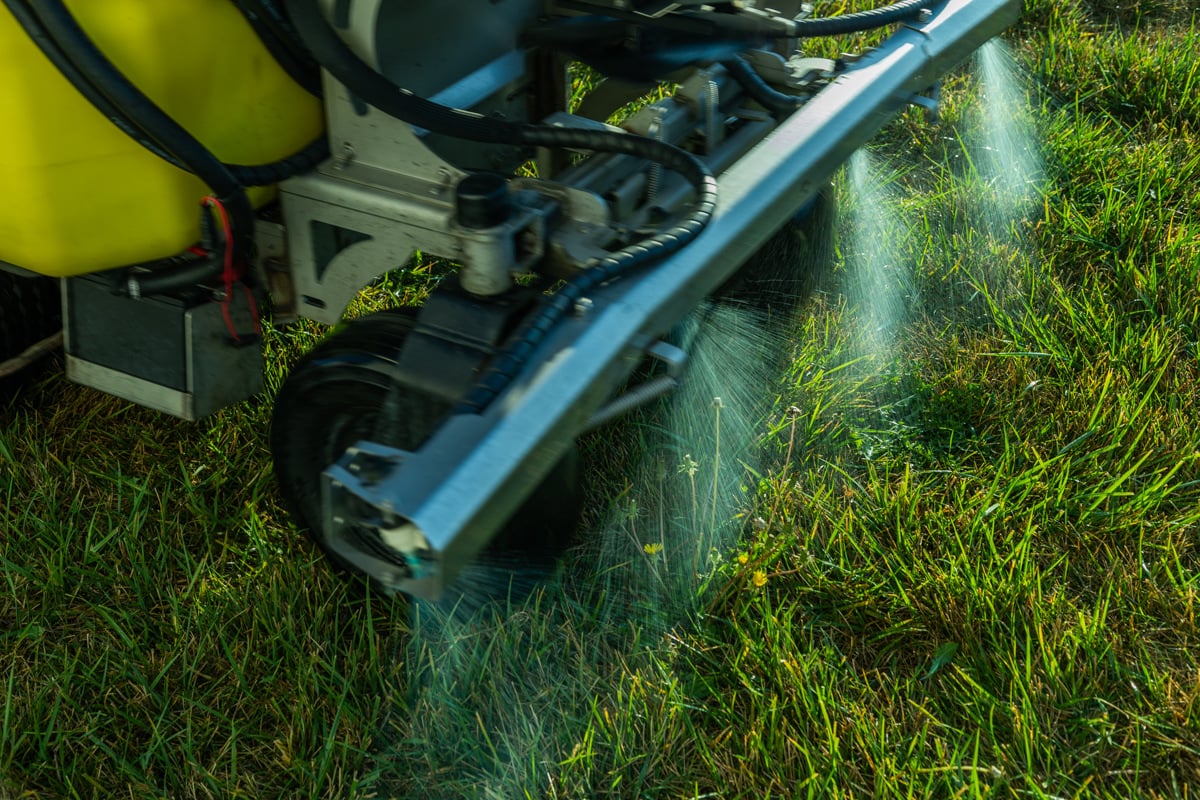 liquid aeration being sprayed on a lawn