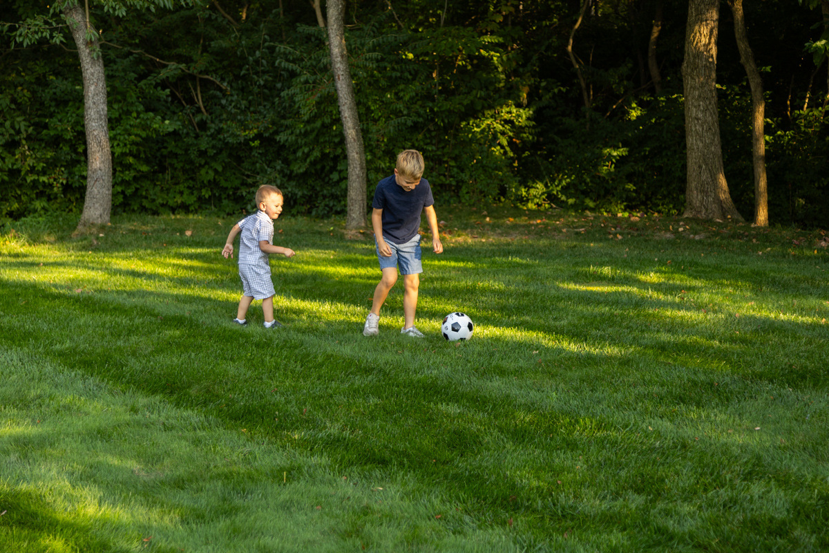 client family kids playing lawn grass 3