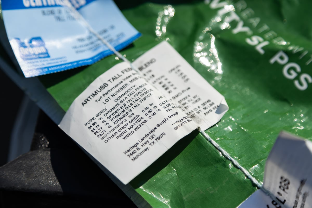 a label on a grass seed bag explaining the blend of TTTF seed within
