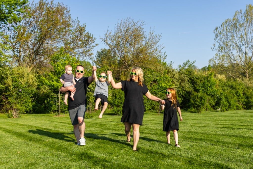 happy family customer playing grass lawn shades 2