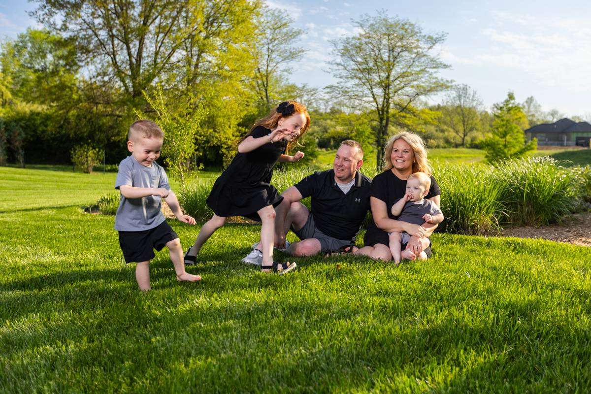 family enjoying lush green lawn in Attica, IN