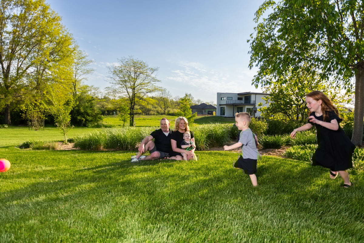 happy family customer playing grass lawn